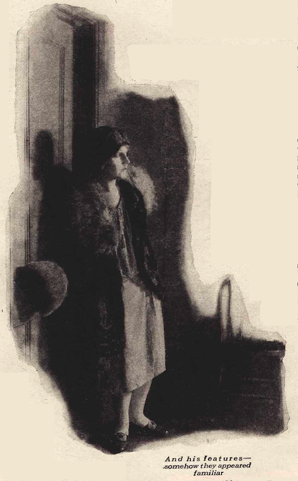 A woman stands in doorway, looking in.