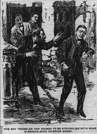 A bearded man approaches a distressed-looking boy, who stands with his eyes closed. Two other men watch in the background.