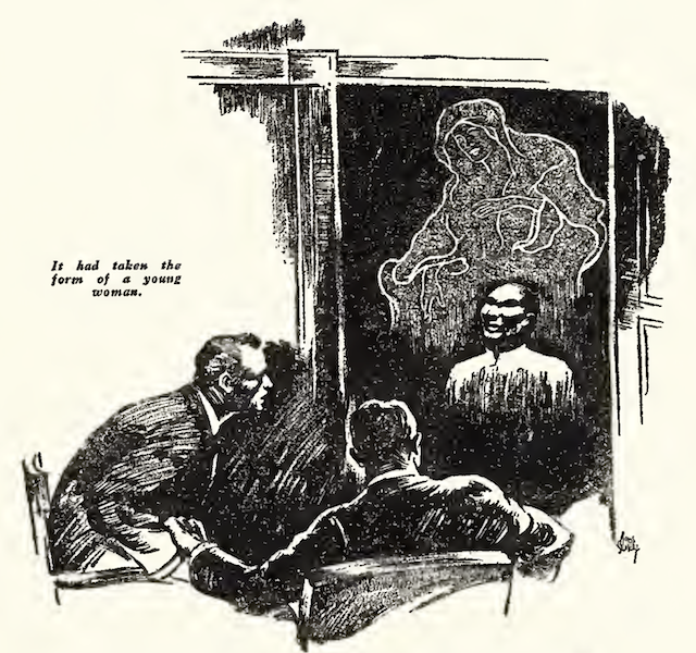 An Asian medium sits in a cabinet, with an ectoplasmic apparition of a woman behind him. Two men seated in front of the cabinet look on in amazement.